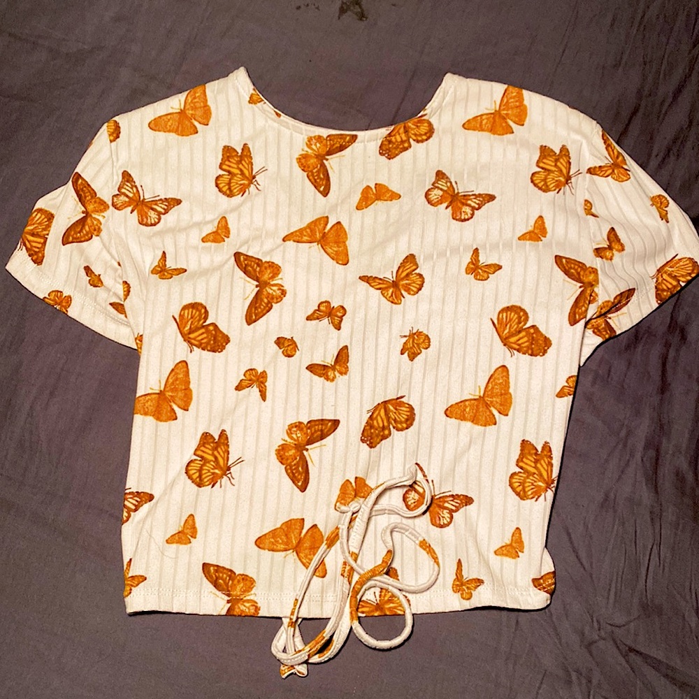 White top with brown/orange butterflies.